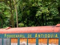 MEDELLIN, COLOMBIA - Dec 03, 2020: Old Train Car Reused with the Name of Ã¢â¬ÅRailroad of AntioquiaÃ¢â¬Å in a Forest Royalty Free Stock Photo
